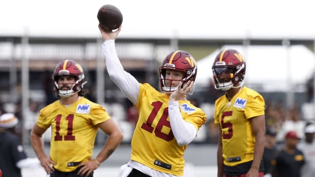 Washington Commanders quarterbacks Jeff Driskel, Jayden Daniels, and Sam Hartman.