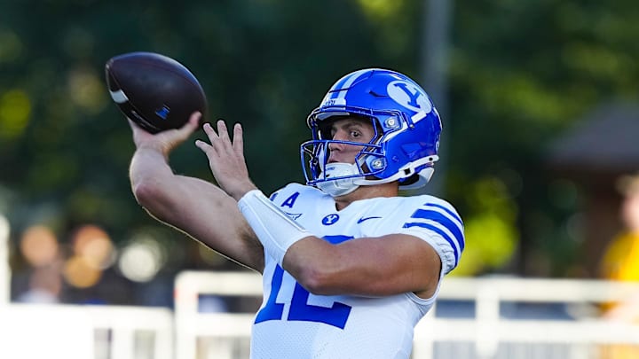 Sep 14, 2024; Laramie, Wyoming, USA; Brigham Young Cougars quarterback Jake Retzlaff (12) warms up before the game against the Wyoming Cowboys at Jonah Field at War Memorial Stadium. Mandatory Credit: Troy Babbitt-Imagn Images Sep 14, 2024; Laramie, Wyoming, USA; Brigham Young Cougars quarterback Jake Retzlaff (12) warms up before the game against the Wyoming Cowboys at Jonah Field at War Memorial Stadium. Mandatory Credit: Troy Babbitt-Imagn Images