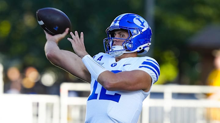 Sep 14, 2024; Laramie, Wyoming, USA; Brigham Young Cougars quarterback Jake Retzlaff (12) warms up before the game against the Wyoming Cowboys at Jonah Field at War Memorial Stadium.