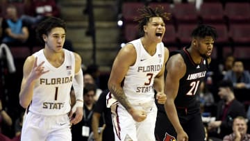 Dec 10, 2022; Tallahassee, Florida, USA; Florida State Seminoles forward Cameron Corhen (3) and guard Jalen Warley (1) react to a made basket during the game against the Louisville Cardinals at Donald L. Tucker Center. Mandatory Credit: Melina Myers-USA TODAY Sports