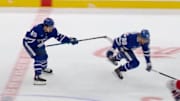 Nicholas Robertson pushed down teammate William Nylander in a preseason game.