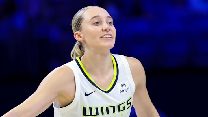 Jul 3, 2025; Arlington, Texas, USA;  Dallas Wings guard Paige Bueckers (5) reacts against the Phoenix Mercury  during the first half at College Park Center. Mandatory Credit: Kevin Jairaj-Imagn Images