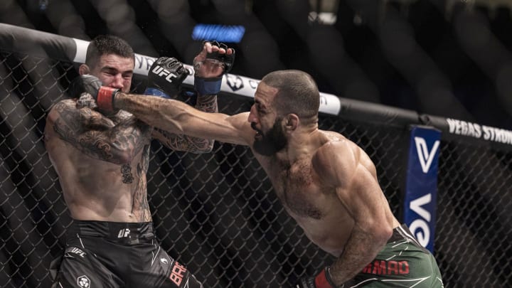 Oct 22, 2022; Abu Dhabi, UAE; Belal Muhammad (red gloves) and Sean Brady (blue gloves) during UFC 280 at Etihad Arena. Mandatory Credit: Craig Kidwell-USA TODAY Sports