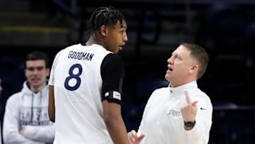 Feb 4, 2025; University Park, Pennsylvania, USA; Penn State Nittany Lions head coach Mike Rhoades talks with forward Miles Goodman (8) during the second half against the Minnesota Golden Gophers at Bryce Jordan Center. Minnesota defeated Penn State 69-61. Mandatory Credit: Matthew O'Haren-Imagn Images