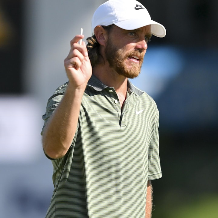 Tommy Fleetwood waves to the crowd as he walks to the eighteenth green during the third round of the FedEx St. Jude Champions