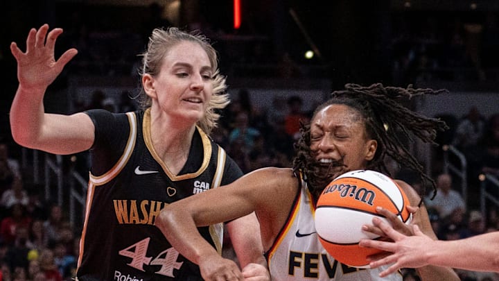 Indiana Fever guard Kelsey Mitchell (0) rushes up the court against Washington Mystics guard Karlie Samuelson (44) Wednesday, June 19, 2024, during the game at Gainbridge Fieldhouse in Indianapolis. The Indiana Fever defeated the Washington Mystics, 88 - 81.