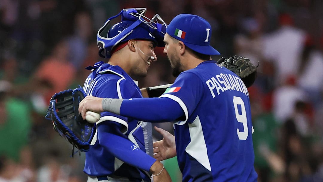 Italy catcher J.J. D’Orazio, left, hugs first baseman Vinnie Pasquantino after defeating Mexico on Wednesday to advance to the quarterfinals.