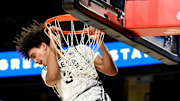 Vanderbilt guard Tyler Tanner (3) hangs on the rim after a dunk against California during an NCAA college basketball game Wednesday, Nov. 13, 2024, in Nashville, Tenn. Tanner was called for a technical foul for hanging on the rim after the dunk