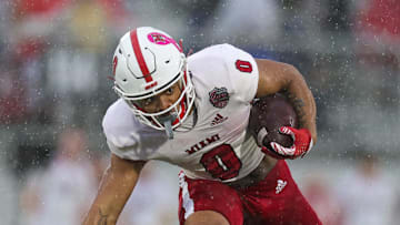 Dec 16, 2023; Orlando, FL, USA;  Miami (OH) Redhawks running back Rashad Amos (0) runs with the ball against the Appalachian State Mountaineers in the first quarter during the Avocados from Mexico Cure Bowl at FBC Mortgage Stadium. Mandatory Credit: Nathan Ray Seebeck-Imagn Images
