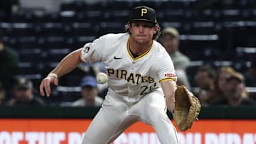 Sep 24, 2024; Pittsburgh, Pennsylvania, USA;  Pittsburgh Pirates first baseman Billy Cook (28) takes a throw at first base to retire Milwaukee Brewers catcher William Contreras (not pictured) during the third inning at PNC Park. Mandatory Credit: Charles LeClaire-Imagn Images