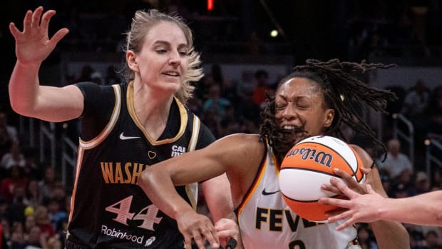 Indiana Fever guard Kelsey Mitchell (0) rushes up the court against Washington Mystics guard Karlie Samuelson