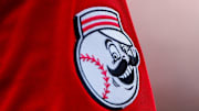 Jun 24, 2023; Cincinnati, Ohio, USA; The Cincinnati Reds logo on the sleeve of Cincinnati Reds shortstop Elly De La Cruz (44) while he prepares on deck during the fifth inning against the Atlanta Braves at Great American Ball Park. Mandatory Credit: Katie Stratman-Imagn Images