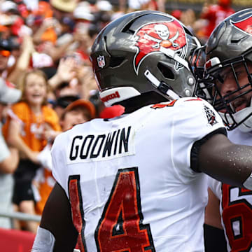 Sep 22, 2024; Tampa, Florida, USA; Tampa Bay Buccaneers wide receiver Chris Godwin (14) celebrates with guard Ben Bredeson (68) after he scored a touchdown against the Denver Broncos during the first half at Raymond James Stadium. Mandatory Credit: Kim Klement Neitzel-Imagn Images