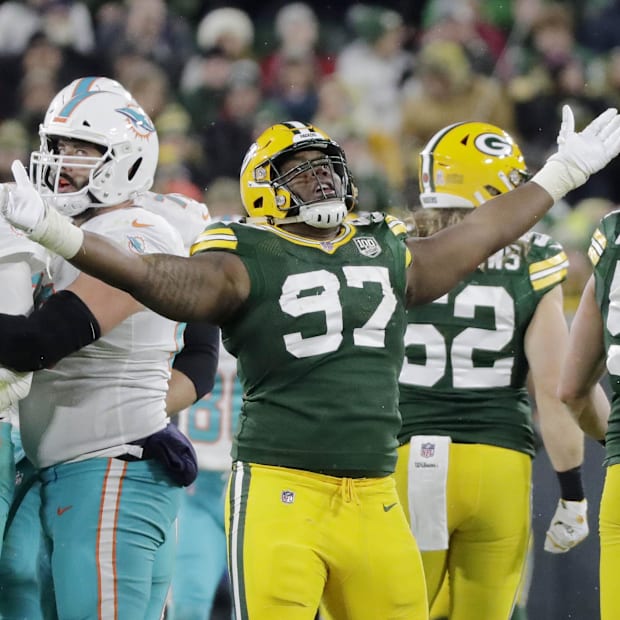 Green Bay Packers nose tackle Kenny Clark reacts after sacking Miami Dolphins quarterback Brock Osweiler at Lambeau Field