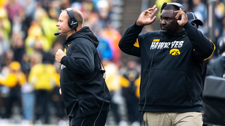 Seth Wallace, left, and Iowa defensive line coach Kelvin Bell call out to players during a NCAA Big Ten Conference football game between the Iowa Hawkeyes and Purdue, Saturday, Oct., 19, 2019, at Kinnick Stadium in Iowa City, Iowa.