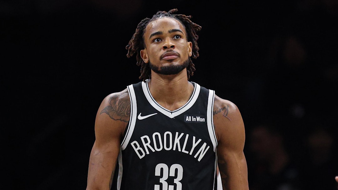 Dec 6, 2025; Brooklyn, New York, USA; Brooklyn Nets center Nic Claxton (33) reacts after being fouled by New Orleans Pelicans center Derik Queen (22) during the first quarter at Barclays Center. Mandatory Credit: Vincent Carchietta-Imagn Images
