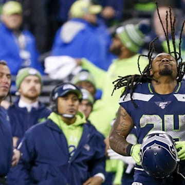 Dec 29, 2019; Seattle, Washington, USA; Seattle Seahawks running back Marshawn Lynch (24) puts on his helmet during the fourth quarter against the San Francisco 49ers at CenturyLink Field.