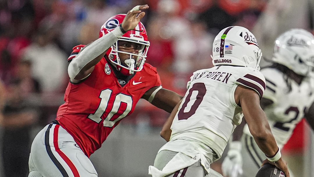 Oct 12, 2024; Athens, Georgia, USA; Georgia Bulldogs linebacker Damon Wilson II (10) tries to tackle Mississippi State Bulldogs quarterback Michael Van Buren Jr. (0) at Sanford Stadium. 