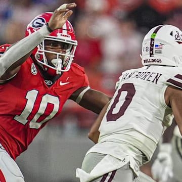 Oct 12, 2024; Athens, Georgia, USA; Georgia Bulldogs linebacker Damon Wilson II (10) tries to tackle Mississippi State Bulldogs quarterback Michael Van Buren Jr. (0) at Sanford Stadium. Mandatory Credit: Dale Zanine-Imagn Images