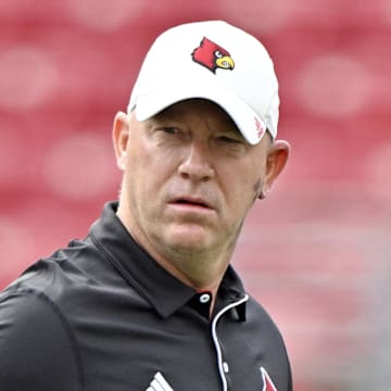 Aug 31, 2024; Louisville, Kentucky, USA;  Louisville Cardinals head coach Jeff Brohm watches during warmups before facing off against the Austin Peay Governors at L&N Federal Credit Union Stadium. Mandatory Credit: Jamie Rhodes-Imagn Images