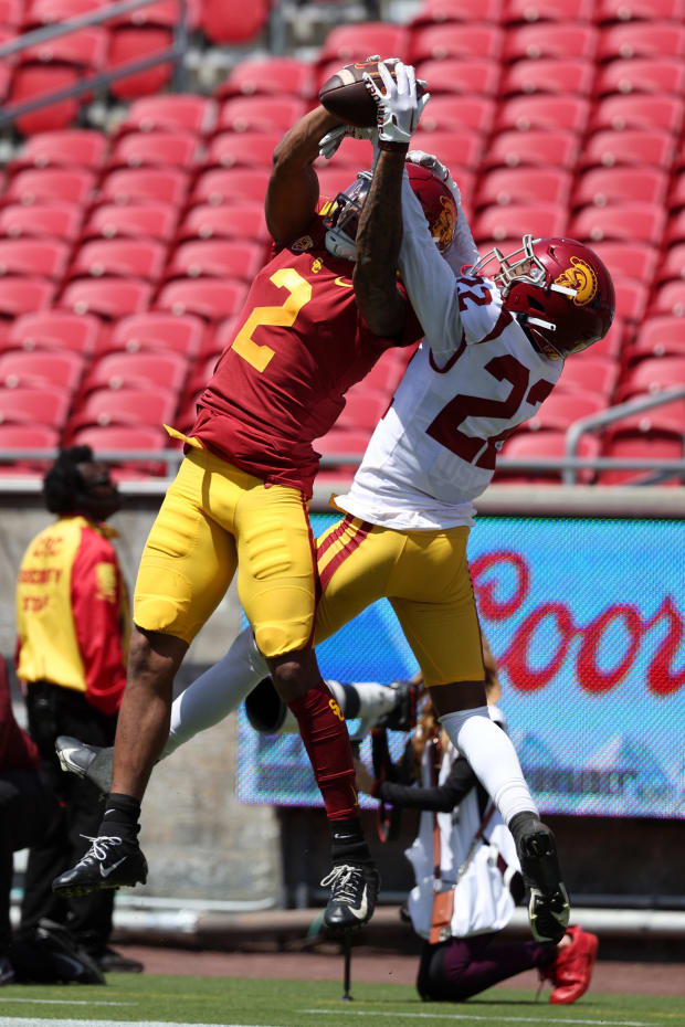 USC Trojans wide receiver Brenden Rice (2) and defensive back Ceyair Wright (22) fight for a pass during the 2023 Spring Game