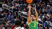 Mar 21, 2024; Pittsburgh, PA, USA; Oregon Ducks guard Jackson Shelstad (3) shoots the ball against South Carolina Gamecocks forward Collin Murray-Boyles (30) during the first half in the first round of the 2024 NCAA Tournament at PPG Paints Arena. Mandatory Credit: Charles LeClaire-Imagn Images