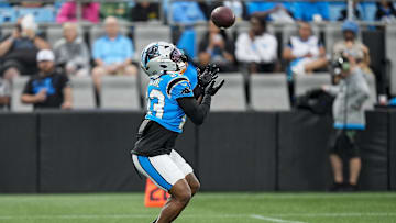 Aug 2, 2025; Charlottle, NC, USA; Carolina Panthers running back Trevor Etienne (23) makes a catch during Fanfest at Bank of America Stadium. Mandatory Credit: Jim Dedmon-Imagn Images