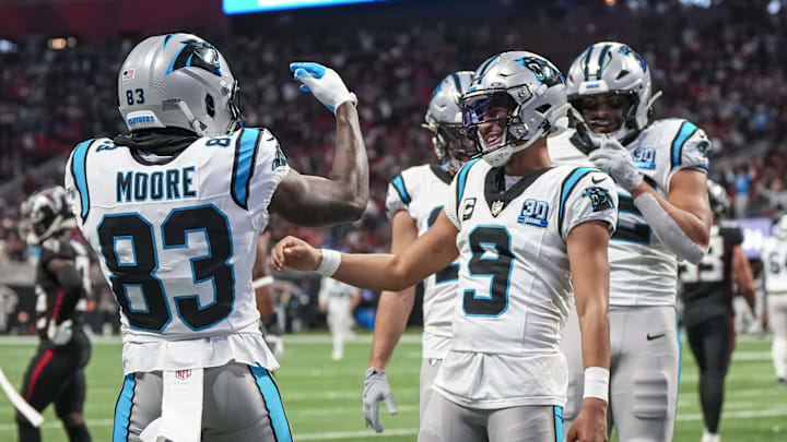 Jan 5, 2025; Atlanta, Georgia, USA; Carolina Panthers quarterback Bryce Young (9) reacts with wide receiver David Moore (83) after running for a touchdown against the Atlanta Falcons during the second half at Mercedes-Benz Stadium. Jan 5, 2025; Atlanta, Georgia, USA; Carolina Panthers quarterback Bryce Young (9) reacts with wide receiver David Moore (83) after running for a touchdown against the Atlanta Falcons during the second half at Mercedes-Benz Stadium.