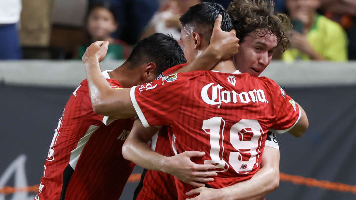 Aug 9, 2024; Houston, Texas, USA;Toluca forward Edgar Lopez (19) celebrates his goal with teammates against the Houston Dynamo late in the second half at Shell Energy Stadium. Mandatory Credit: Thomas Shea-USA TODAY Sports