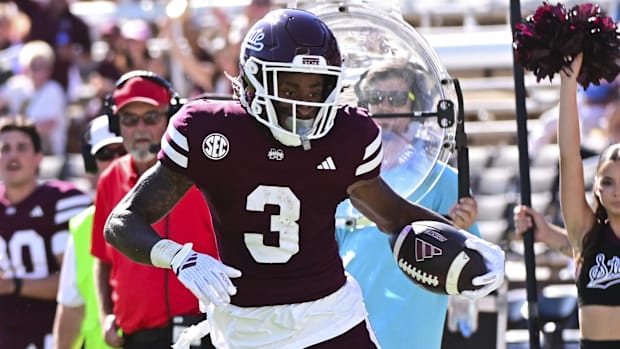 Mississippi State Bulldogs wide receiver Kevin Coleman Jr. (3) runs for a touchdown while defended by Arkansas Razorbacks.