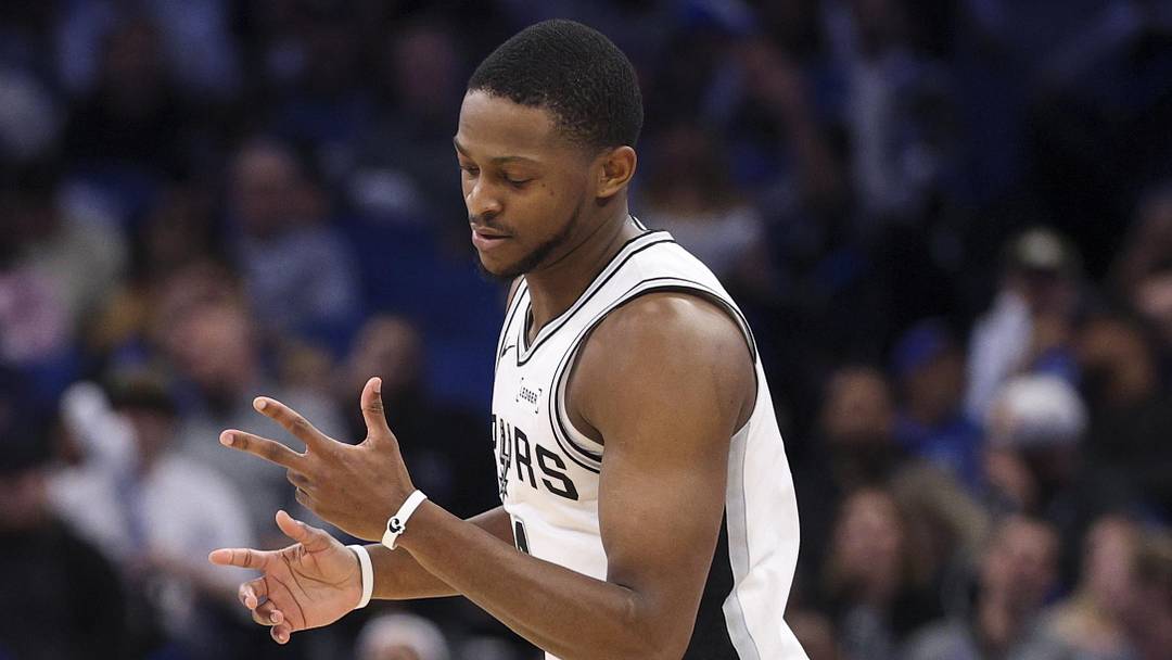 Dec 3, 2025; Orlando, Florida, USA; San Antonio Spurs guard De'Aaron Fox (4) reacts after a three point basket against the Orlando Magic in the fourth quarter at Kia Center. Mandatory Credit: Nathan Ray Seebeck-Imagn Images