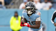 Nov 2, 2025; Nashville, Tennessee, USA;  Tennessee Titans tight end Chigoziem Okonkwo (85) runs with the ball after a made catch against the Los Angeles Chargers during the first half at Nissan Stadium. Mandatory Credit: Steve Roberts-Imagn Images