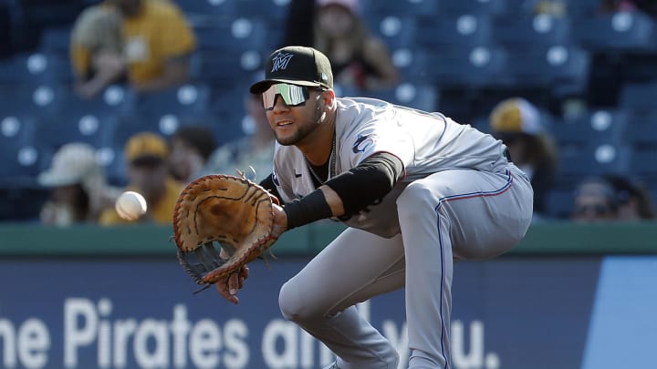 Oct 1, 2023; Pittsburgh, Pennsylvania, USA;  Miami Marlins first baseman Yuli Gurriel (10) takes a throw to retire Pittsburgh Pirates designated hitter Henry Davis (not pictured) during the fourth inning at PNC Park. 