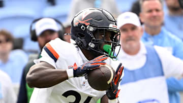 Oct 25, 2025; Chapel Hill, North Carolina, USA; Virginia Cavaliers running back Harrison Waylee (21) with the ball in the third quarter at Kenan Stadium. Mandatory Credit: Bob Donnan-Imagn Images