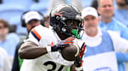 Oct 25, 2025; Chapel Hill, North Carolina, USA; Virginia Cavaliers running back Harrison Waylee (21) with the ball in the third quarter at Kenan Stadium. Mandatory Credit: Bob Donnan-Imagn Images