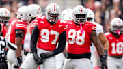 Ohio State Buckeyes defensive end Kenyatta Jackson Jr. (97) and defensive tackle Kayden McDonald (98) celebrate in the first half of the college football game at Ohio Stadium on Saturday, Nov. 1, 2025 in Columbus, Ohio.