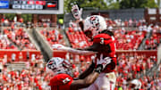 Sep 6, 2025; Raleigh, North Carolina, USA; North Carolina State Wolfpack running back Hollywood Smothers (3), and offensive lineman Matt McCabe (66) celebrate a touchdown during the second half of the game against Virginia Cavaliers at Carter-Finley Stadium. Mandatory Credit: Jaylynn Nash-Imagn Images