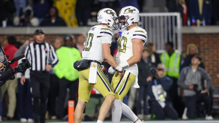 Nov 25, 2023; Atlanta, Georgia, USA; Georgia Tech Yellow Jackets quarterback Haynes King (10) celebrates with tight end Brett Seither (80) after a touchdown run against the Georgia Bulldogs in the second half at Bobby Dodd Stadium at Hyundai Field. Mandatory Credit: Brett Davis-USA TODAY Sports