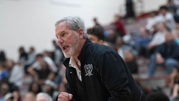 Raiders head coach Terry Posey shouts to his players during the Navarre vs Tate boys basketball game at Tate High School on Friday, Jan. 12, 2024.