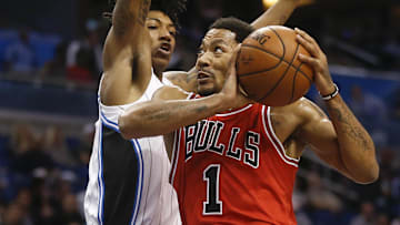 Mar 2, 2016; Orlando, FL, USA; Chicago Bulls guard Derrick Rose (1) drives past Orlando Magic guard Elfrid Payton (4) during the first quarter of a basketball game at Amway Center. Mandatory Credit: Reinhold Matay-Imagn Images