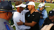 Sep 20, 2025; Oxford, Mississippi, USA; Mississippi Rebels head coach Lane Kiffin (left) and Tulane Green Wave head coach Jon Sumrall (right) embrace after the game at Vaught-Hemingway Stadium. Mandatory Credit: Petre Thomas-Imagn Images