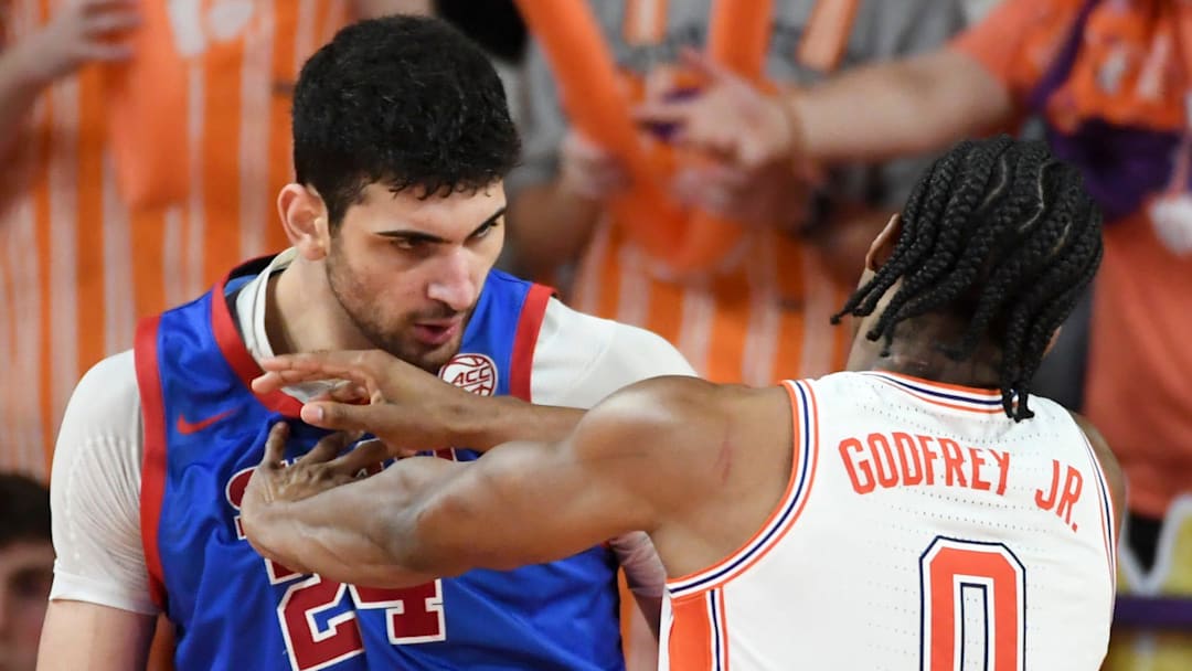 Clemson Tigers forward RJ Godfrey (0) pushes SMU Mustangs center Samet Yigitoglu (24) during game at Littlejohn Coliseum in Clemson, S.C.