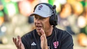 Oct 11, 2025; South Bend, Indiana, USA; NC State Wolfpack head coach Dave Doeren claps as he walks onto the field against the Notre Dame Fighting Irish during the second half at Notre Dame Stadium. Mandatory Credit: Michael Caterina-Imagn Images