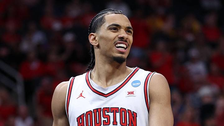 Mar 26, 2026; Houston, TX, USA; Houston Cougars guard Milos Uzan (7) reacts in the first half during a Sweet Sixteen game of the South Regional of the men's 2026 NCAA Tournament at Toyota Center. Mandatory Credit: Troy Taormina-Imagn Images