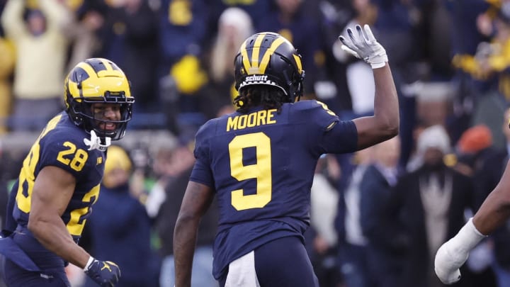 Nov 25, 2023; Ann Arbor, Michigan, USA; Michigan Wolverines defensive back Rod Moore (9) celebrates after he makes an interception in the second half against the Ohio State Buckeyes at Michigan Stadium. Mandatory Credit: Rick Osentoski-USA TODAY Sports