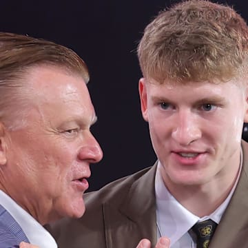 Jun 25, 2025; Brooklyn, NY, USA;  Kasparas Jakucionis reacts with Illinois Fighting Illini head coach Brad Underwood after being selected as the 20th pick by the Miami Heat in the first round of the 2025 NBA Draft at Barclays Center. Mandatory Credit: Brad Penner-Imagn Images