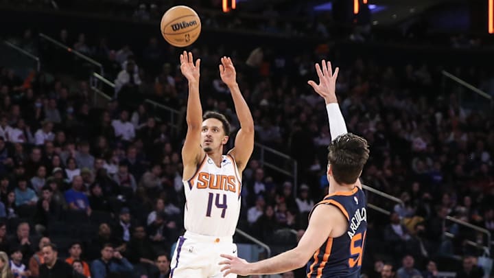 Jan 2, 2023; New York, New York, USA; Phoenix Suns guard Landry Shamet (14) takes a three point shot in the fourth quarter against the Phoenix Suns at Madison Square Garden. Mandatory Credit: Wendell Cruz-Imagn Images