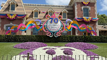 A Mickey Mouse topiary display welcomes guests to the entrance to Disneyland Park for its 70th anniversary.