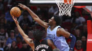 Mar 1, 2023; Houston, Texas, USA; Memphis Grizzlies forward Jaren Jackson Jr. (13) defends against Houston Rockets guard Josh Christopher (9) during the second quarter at Toyota Center.