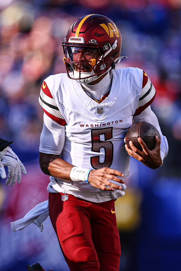 Washington Commanders quarterback Jayden Daniels scrambles during the first half against the New York Giants Washington Commanders quarterback Jayden Daniels scrambles during the first half against the New York Giants